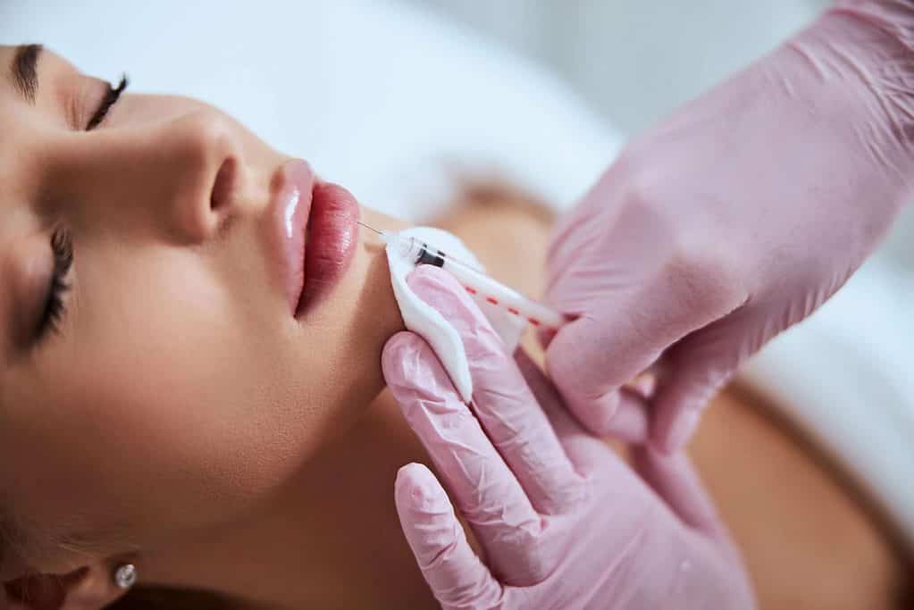 Someone receiving lip injections.