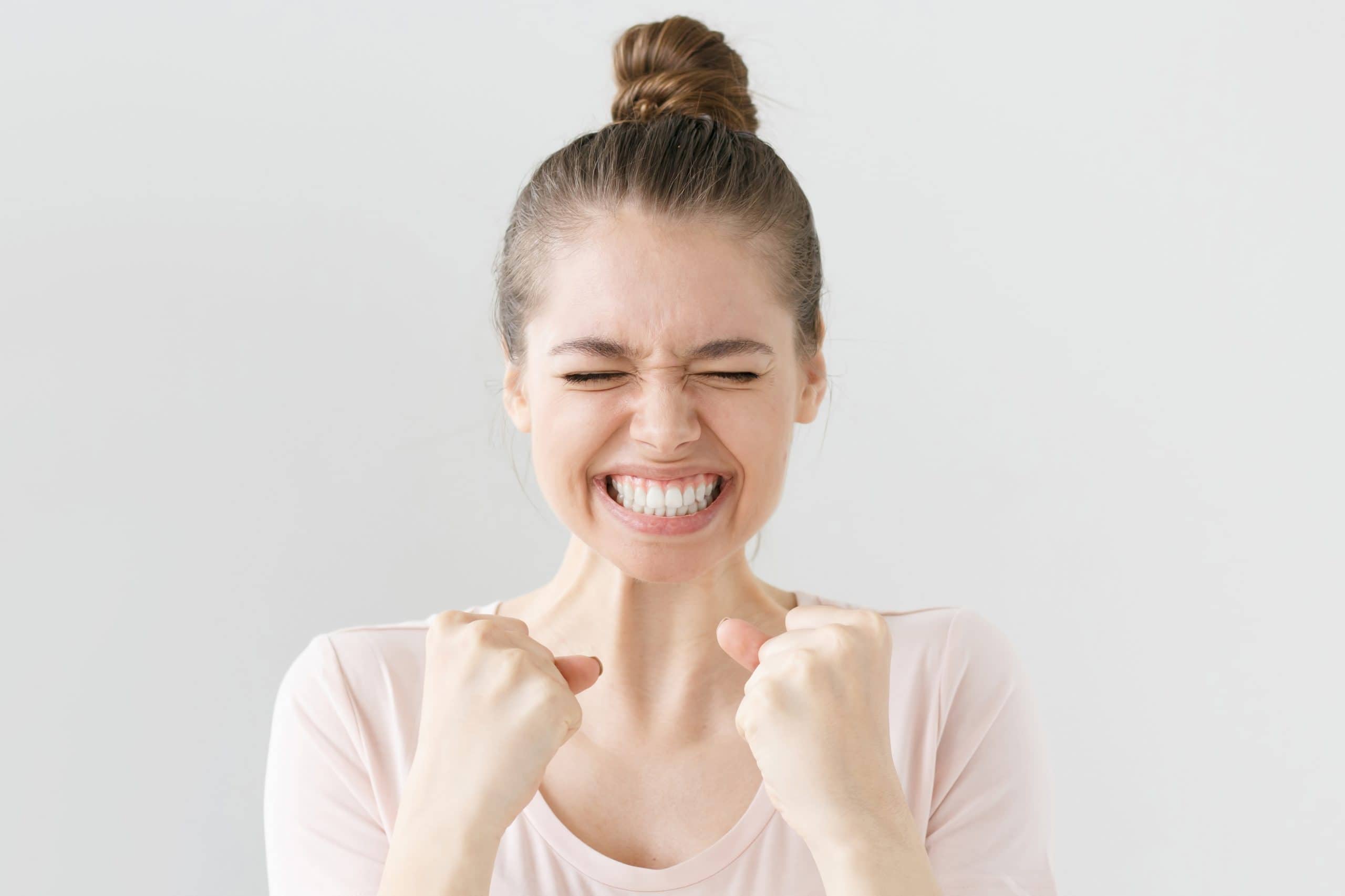 Woman smiling after hearing more membership program details.