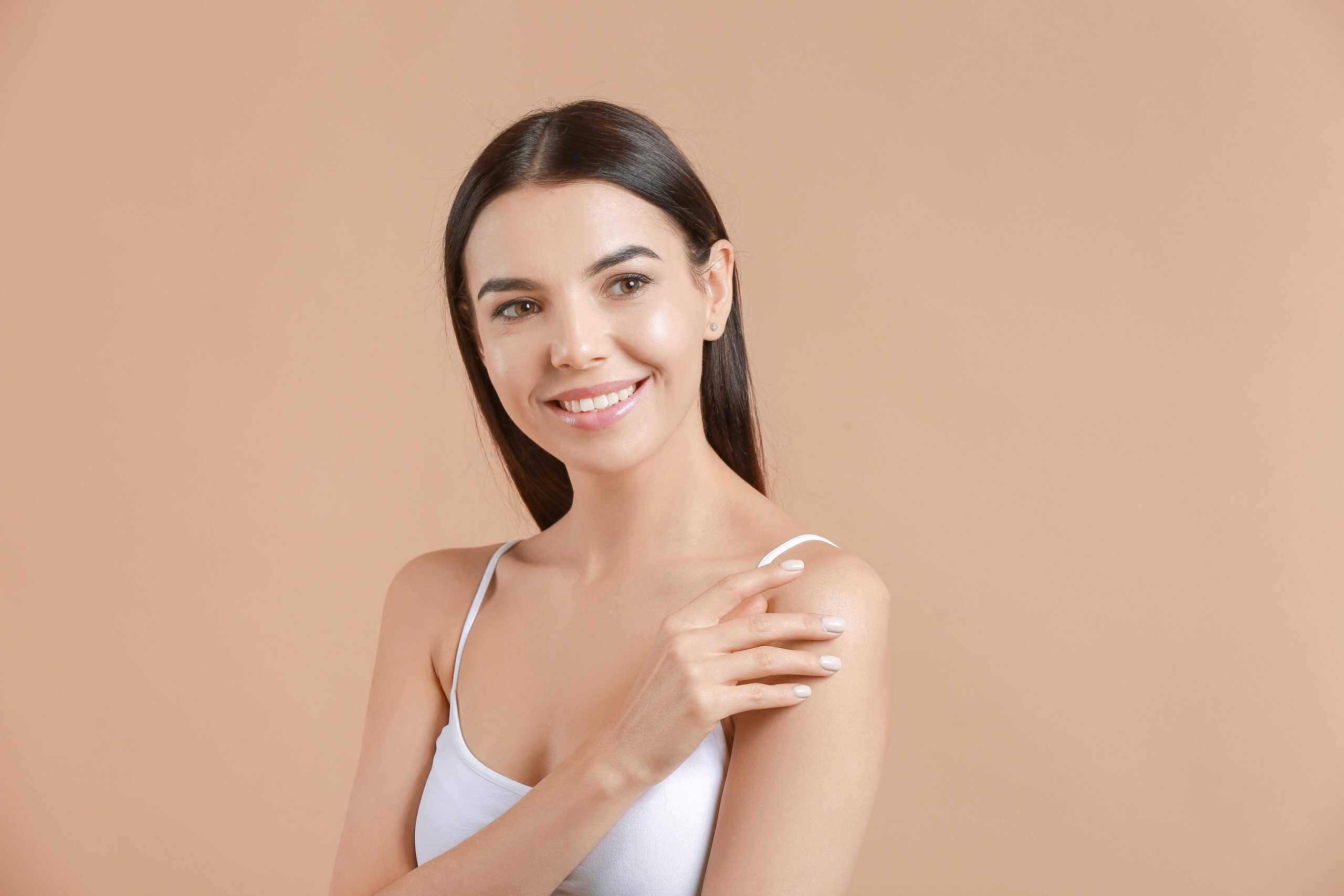 Woman with clear skin smiling.