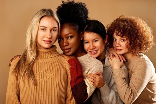 4 women with smooth skin during the fall season.